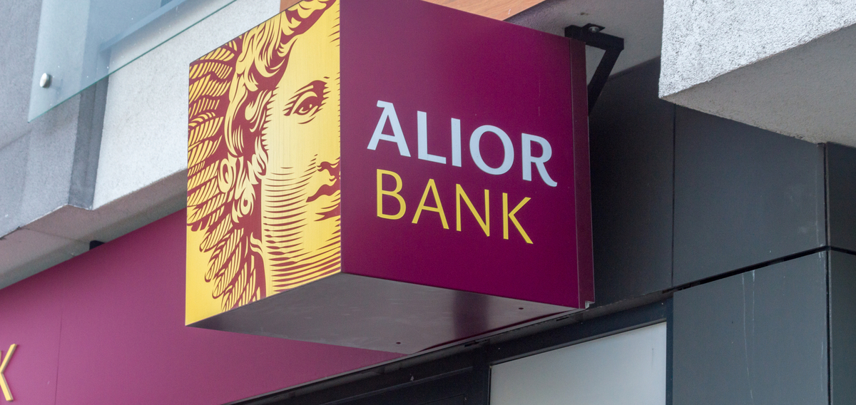 Alior Bank branch signage with the bank's maroon and gold crest logo.